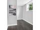 Hallway features vinyl floors, white trim and a painting adding a touch of art at 6539 Hayes Dr, Riverdale, GA 30274