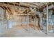 Unfinished basement with exposed pipes and concrete walls, offering potential for customization at 1579 Mayflower Sw Ave, Atlanta, GA 30311