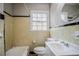 Bathroom with black and yellow tile, toilet and bathtub at 1579 Mayflower Sw Ave, Atlanta, GA 30311