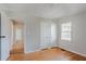 Spacious bedroom with hardwood floors, a closet, and natural light from window at 1579 Mayflower Sw Ave, Atlanta, GA 30311