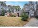 Beautiful home showcasing a classic design with a brick facade and mature trees at 1579 Mayflower Sw Ave, Atlanta, GA 30311