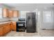 Classic kitchen with black appliances, wood cabinets, and access to a bright breakfast nook at 1579 Mayflower Sw Ave, Atlanta, GA 30311