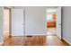 View from living room of eat-in kitchen with wood cabinets and a door at 1579 Mayflower Sw Ave, Atlanta, GA 30311