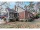 A charming brick home boasts a screened porch and a spacious backyard ready for outdoor living and entertaining at 1579 Mayflower Sw Ave, Atlanta, GA 30311