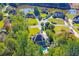 Gorgeous aerial view of a lakeside community with mature trees and rolling green lawns at 2660 Portabella Ln, Cumming, GA 30041