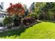 Gorgeous backyard with lush lawn, stone stairway and detailed landscaping at 2660 Portabella Ln, Cumming, GA 30041