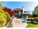 An amazing backyard with a pool, well manicured landscaping, and a brick patio is great for entertaining at 2660 Portabella Ln, Cumming, GA 30041