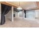 Spacious finished basement with carpeted floors, structural columns, and decorative curtains for a comfortable atmosphere at 2660 Portabella Ln, Cumming, GA 30041