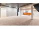 Finished basement with a built-in bar, carpeted floors, and recessed lighting create an inviting entertaining space at 2660 Portabella Ln, Cumming, GA 30041