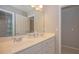 Bright bathroom with double sink vanity, ample storage, and neutral color scheme at 2660 Portabella Ln, Cumming, GA 30041