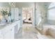 Bathroom features dual sinks with granite countertops, a large walk-in shower, and an entrance to the main bedroom at 2660 Portabella Ln, Cumming, GA 30041