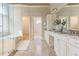 Bright bathroom features a double vanity, granite countertops, tiled floors, and a glass shower with soaking tub at 2660 Portabella Ln, Cumming, GA 30041