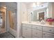 Bright bathroom featuring a white vanity, modern fixtures, and a shower-tub combination, offering a clean design at 2660 Portabella Ln, Cumming, GA 30041
