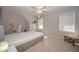 Comfortable bedroom with a sloped ceiling, neutral colors, and carpet flooring, creating a calming retreat at 2660 Portabella Ln, Cumming, GA 30041