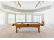 Bright billiard room with a pool table, and ample natural light, perfect for entertaining and recreation at 2660 Portabella Ln, Cumming, GA 30041