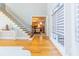 Foyer featuring hardwood floors, staircase with iron railings, and plenty of natural light at 2660 Portabella Ln, Cumming, GA 30041