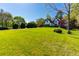 Spacious front lawn with mature trees and impeccable landscaping at 2660 Portabella Ln, Cumming, GA 30041
