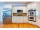 Well-equipped kitchen with stainless steel appliances and ample cabinet space at 2660 Portabella Ln, Cumming, GA 30041