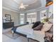 Large main bedroom boasting a sitting area, stylish decor, and windows overlooking the yard at 2660 Portabella Ln, Cumming, GA 30041
