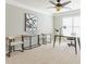 Bright and airy office space with modern decor and a ceiling fan at 2660 Portabella Ln, Cumming, GA 30041