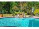 Sparkling pool has a stunning waterfall feature at 2660 Portabella Ln, Cumming, GA 30041