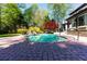 Beautiful pool and patio with lush landscaping at 2660 Portabella Ln, Cumming, GA 30041