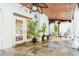 Inviting sunroom with stone floor and wood-paneled ceiling, perfect for relaxation at 2660 Portabella Ln, Cumming, GA 30041