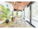 Charming sunroom with stone flooring, wood ceiling, and abundant natural light at 2660 Portabella Ln, Cumming, GA 30041