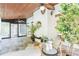 Relaxing sunroom with stone flooring, wood ceiling, and views of the outdoors at 2660 Portabella Ln, Cumming, GA 30041