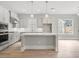 A modern kitchen with a large island, stainless steel appliances, and bright, airy atmosphere at 408 Vinca Nw Cir, Kennesaw, GA 30144