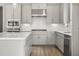 A modern kitchen with white cabinets, stainless steel appliances, and marble countertops at 408 Vinca Nw Cir, Kennesaw, GA 30144