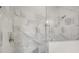 A luxurious walk-in shower featuring elegant tile work and modern fixtures at 408 Vinca Nw Cir, Kennesaw, GA 30144