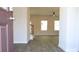 Inviting entryway featuring wood-look flooring and staircase leading to a spacious living area at 651 Egrets Landing #53, Covington, GA 30014