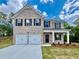 Charming two-story brick home with a two-car garage and well-maintained lawn at 651 Egrets Landing #53, Covington, GA 30014