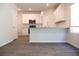 Modern kitchen featuring white cabinets, stainless steel appliances, and granite countertops at 651 Egrets Landing #53, Covington, GA 30014