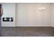 Bright living room with recessed electric fireplace and contemporary chandelier at 651 Egrets Landing #53, Covington, GA 30014