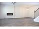 Spacious living room with stylish electric fireplace and sleek flooring at 651 Egrets Landing #53, Covington, GA 30014