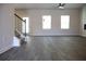 Spacious living room featuring modern flooring, lots of natural light, and staircase at 651 Egrets Landing #53, Covington, GA 30014