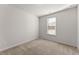 Bright bedroom with a window covered by white blinds allowing natural light to brighten the room at 7995 Brewton Creek Dr, Cumming, GA 30028