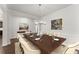 Formal dining room with large table and chairs, offering an elegant space for entertaining at 7995 Brewton Creek Dr, Cumming, GA 30028