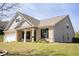 Well-maintained home with a brick and siding exterior, complemented by a lush green lawn and tidy landscaping at 7995 Brewton Creek Dr, Cumming, GA 30028