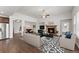 Staged living room showcases the open layout, stone fireplace, and stylish decor, blending comfort and sophistication at 7995 Brewton Creek Dr, Cumming, GA 30028