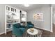 Cozy living room with stylish furnishings, including bookshelves and plush chairs, perfect for relaxation at 7995 Brewton Creek Dr, Cumming, GA 30028