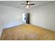 Neutral bedroom featuring a ceiling fan, plush carpet and white walls at 1022 Mayson Turner Nw Rd, Atlanta, GA 30314