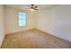 Bright bedroom with a large window offering plenty of natural light and plush neutral carpet at 1022 Mayson Turner Nw Rd, Atlanta, GA 30314