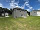 Well-maintained backyard offers privacy and space, showcasing the home's exterior at 642 Egrets Landing #66, Covington, GA 30014