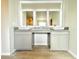 Bathroom featuring double vanity with granite countertops, vessel sinks, and stylish mirrors at 642 Egrets Landing #66, Covington, GA 30014