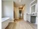 Relaxing bathroom with standalone soaking tub and a glass enclosed shower at 642 Egrets Landing #66, Covington, GA 30014
