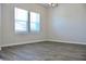 Bright, open dining room with stylish chandelier and large windows at 642 Egrets Landing #66, Covington, GA 30014