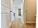 Hallway showing tile flooring and an open view to the bathroom and closet at 642 Egrets Landing #66, Covington, GA 30014